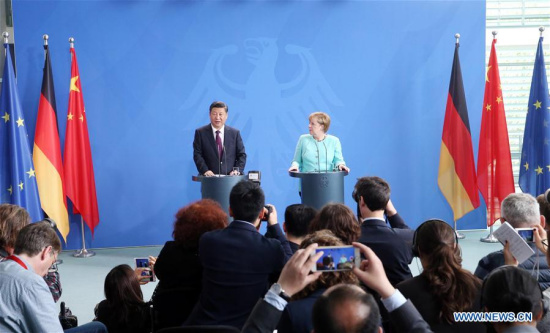 Chinese President Xi Jinping (back, L) and German Chancellor Angela Merkel (back, R) attend a joint press conference after their talks in Berlin, capital of Germany, July 5, 2017. (Xinhua/Yao Dawei) Chinese President Xi Jinping (back, L) and German Chancellor Angela Merkel (back, R) attend a joint press conference after their talks in Berlin, capital of Germany, July 5, 2017. (Xinhua/Yao Dawei)