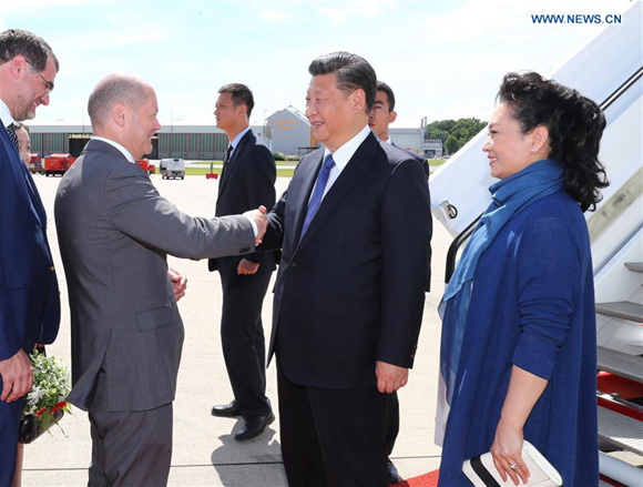 Chinese President Xi Jinping and his wife Peng Liyuan arrive at the airport in Hamburg, Germany, July 6, 2017. Xi Jinping arrived in the northern German city of Hamburg Thursday for the 12th Group of 20 (G20) Summit. (Xinhua/Xie Huanchi) Chinese President Xi Jinping and his wife Peng Liyuan arrive at the airport in Hamburg, Germany, July 6, 2017. Xi Jinping arrived in the northern German city of Hamburg Thursday for the 12th Group of 20 (G20) Summit. (Xinhua/Xie Huanchi)