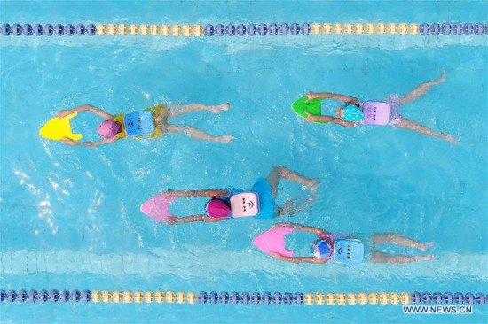 Children cool off in a swimming pool in Xingtai City, north China's Hebei Province, July 2, 2017. (Xinhua/Chen Lei) Children cool off in a swimming pool in Xingtai City, north China's Hebei Province, July 2, 2017. (Xinhua/Chen Lei)