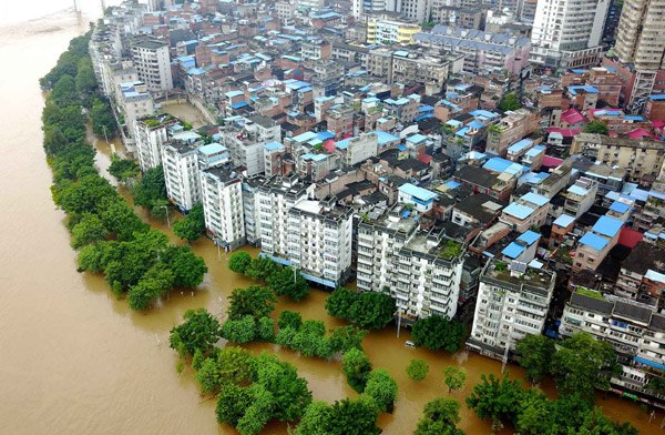 Floodwaters from the Liujiang River soak part of Liuzhou in the Guangxi Zhuang autonomous region on Tuesday. It was the third flood in the city since June 29. (Photo by Li Hanchi/For China Daily) Floodwaters from the Liujiang River soak part of Liuzhou in the Guangxi Zhuang autonomous region on Tuesday. It was the third flood in the city since June 29. (Photo by Li Hanchi/For China Daily)