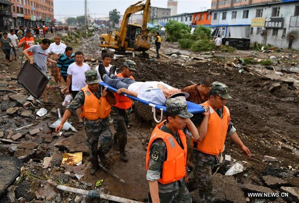 Rescuers transfer an injured person in Yongji County, northeast China's Jilin Province, July 14, 2017. Heavy rain caused waterlogging in Yongji County from July 13 to 14. (Xinhua/Xu Chang) Rescuers transfer an injured person in Yongji County, northeast China's Jilin Province, July 14, 2017. Heavy rain caused waterlogging in Yongji County from July 13 to 14. (Xinhua/Xu Chang)