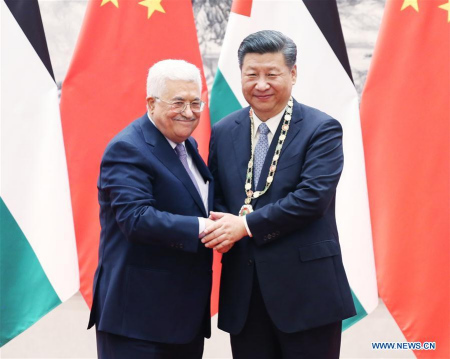 Palestinian President Mahmoud Abbas (L) awards the highest Palestinian medal to Chinese President Xi Jinping after their talks in Beijing, capital of China, July 18, 2017. (Xinhua/Yao Dawei) Palestinian President Mahmoud Abbas (L) awards the highest Palestinian medal to Chinese President Xi Jinping after their talks in Beijing, capital of China, July 18, 2017. (Xinhua/Yao Dawei)