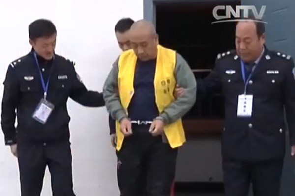 A screen grab shows Gao Chengyong as he is escorted to court in Baiyin, Gansu province. A screen grab shows Gao Chengyong as he is escorted to court in Baiyin, Gansu province.