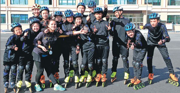 Zhang (fifth from left) and 13 members of the Special Olympics short-track speedskating team in Qitaihe. Zhang (fifth from left) and 13 members of the Special Olympics short-track speedskating team in Qitaihe.