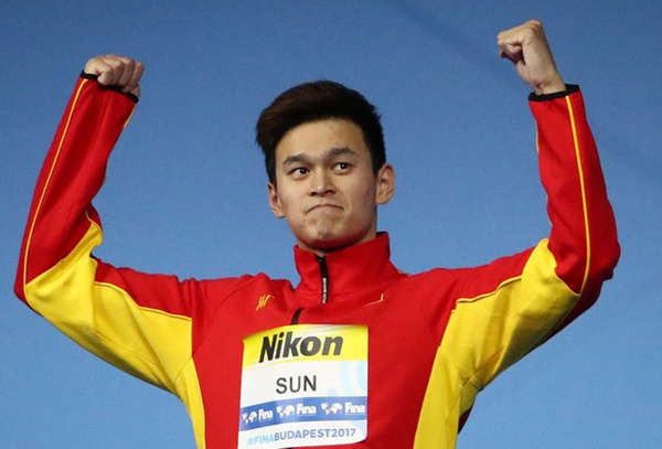 Sun Yang of China celebrates at the podium after winning the men's 200 meters freestyle title at the 17th FINA World Championships in Budapest, July 25, 2017. (Photo/Agencies) Sun Yang of China celebrates at the podium after winning the men's 200 meters freestyle title at the 17th FINA World Championships in Budapest, July 25, 2017. (Photo/Agencies)