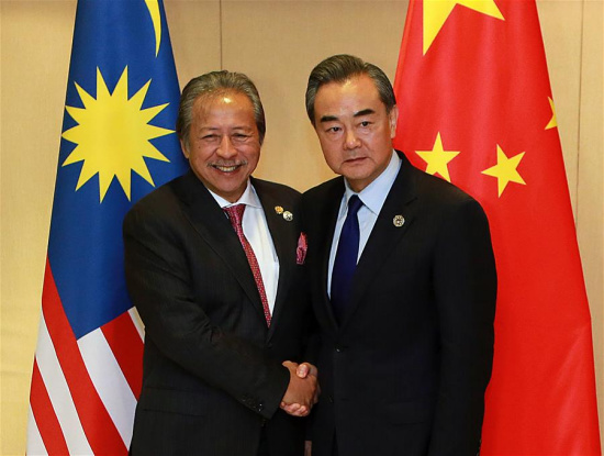 Chinese Foreign Minister Wang Yi (R) meets with his Malaysian counterpart Anifah Aman on the sidelines of a series of ASEAN foreign ministers' meetings in Manila, the Philippines, Aug. 6, 2017. (Xinhua/Rouelle Umali) Chinese Foreign Minister Wang Yi (R) meets with his Malaysian counterpart Anifah Aman on the sidelines of a series of ASEAN foreign ministers' meetings in Manila, the Philippines, Aug. 6, 2017. (Xinhua/Rouelle Umali)