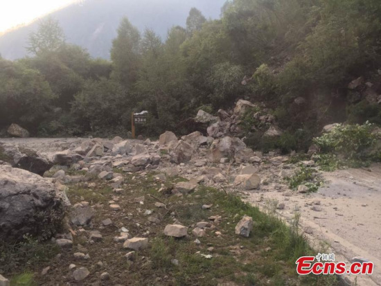A road is littered with fallen stones after an earthquake in Jiuzhaigou County, Southwest China’s Sichuan Province, Aug. 9, 2017. At least 13 people were killed and 175 injured after the earthquake jolted Jiuzhaigou County at 9.19pm. (Photo: China News Service/Cheng Lijun) A road is littered with fallen stones after an earthquake in Jiuzhaigou County, Southwest China’s Sichuan Province, Aug. 9, 2017. At least 13 people were killed and 175 injured after the earthquake jolted Jiuzhaigou County at 9.19pm. (Photo: China News Service/Cheng Lijun)