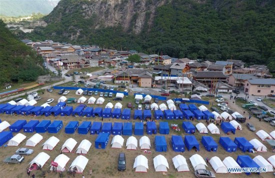 Photo taken on Aug. 11, 2017 shows tents at a temporary shelter in Zhangzha Village of Zhangzha Town in Jiuzhaigou County, southwest China's Sichuan Province, Aug. 11, 2017. (Xinhua/Xue Yubin) Photo taken on Aug. 11, 2017 shows tents at a temporary shelter in Zhangzha Village of Zhangzha Town in Jiuzhaigou County, southwest China's Sichuan Province, Aug. 11, 2017. (Xinhua/Xue Yubin)
