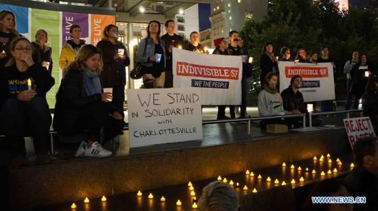 People take part in a candle light vigil in downtown San Francisco, the United States, on August 12, 2017. (Xinhua/Xu Yong) People take part in a candle light vigil in downtown San Francisco, the United States, on August 12, 2017. (Xinhua/Xu Yong)