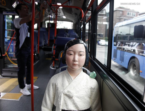 A comfort women statue is seen on a bus in Seoul, South Korea, Aug. 13, 2017. Five buses installed with comfort women statues will be put into operation from Aug.14 to Sept. 30 to commemorate the ladies who were used as sexual slaves during the Second World War and remind people of that very history. (Xinhua/Yao Qilin) A comfort women statue is seen on a bus in Seoul, South Korea, Aug. 13, 2017. Five buses installed with comfort women statues will be put into operation from Aug.14 to Sept. 30 to commemorate the ladies who were used as sexual slaves during the Second World War and remind people of that very history. (Xinhua/Yao Qilin)