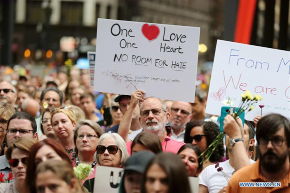 A man holding a sign reads One Love, One Heart, NO ROOM FOR HATE participates in an evening vigil at Federal Plaza in Chicago, the United States, on Aug. 13, 2017. Several hundred people joined a Sunday evening vigil at Federal Plaza in downtown Chicago, for those who fell victim to the violence in Charlottesville of Virginia during the weekend.(Xinhua/Wang Ping) A man holding a sign reads One Love, One Heart, NO ROOM FOR HATE participates in an evening vigil at Federal Plaza in Chicago, the United States, on Aug. 13, 2017. Several hundred people joined a Sunday evening vigil at Federal Plaza in downtown Chicago, for those who fell victim to the violence in Charlottesville of Virginia during the weekend.(Xinhua/Wang Ping)