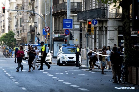 Police officers ask people to leave Plaza Catalonia following a terrorist attack in central Barcelona, Spain, on Aug. 17, 2017. (Xinhua/Lino De Vallier) Police officers ask people to leave Plaza Catalonia following a terrorist attack in central Barcelona, Spain, on Aug. 17, 2017. (Xinhua/Lino De Vallier)