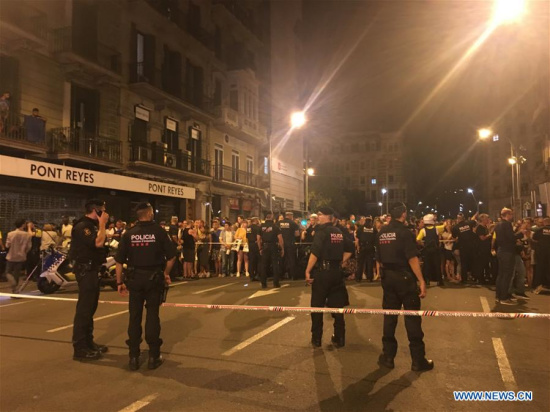 Police cordon off a nearby street following a terrorist attack in central Barcelona, Spain, on Aug. 18, 2017. Thirteen people were confirmed dead and more than 100 others injured, with some of them in very serious condition in Barcelona terror attack on Thursday afternoon, a Spanish official said. (Xinhua/Ying Qiang) Police cordon off a nearby street following a terrorist attack in central Barcelona, Spain, on Aug. 18, 2017. Thirteen people were confirmed dead and more than 100 others injured, with some of them in very serious condition in Barcelona terror attack on Thursday afternoon, a Spanish official said. (Xinhua/Ying Qiang)