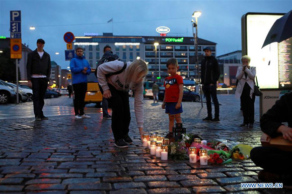 People mourn victims of the stabbing attacks in Turku, southwestern Finland, on Aug. 18, 2017. Several people were stabbed in downtown Turku, southwestern Finland on Friday, when more than one man mounted the attacks simultaneously. At least two died and eight others were injured, according to local media. (Xinhua/Zhang Xuan) People mourn victims of the stabbing attacks in Turku, southwestern Finland, on Aug. 18, 2017. Several people were stabbed in downtown Turku, southwestern Finland on Friday, when more than one man mounted the attacks simultaneously. At least two died and eight others were injured, according to local media. (Xinhua/Zhang Xuan)