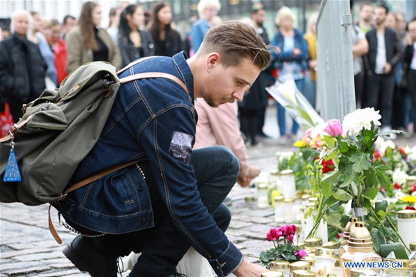 A man places a candle to commemorate the victims of Friday's stabbings at the Turku Market Square, Finland on Aug. 19, 2017. Another four Moroccans were detained and a warrant has been issued for a fifth after a young man stabbed people at the squares in the southwestern Finnish city of Turku, police said on Saturday. (Xinhua/Zhang Xuan) A man places a candle to commemorate the victims of Friday's stabbings at the Turku Market Square, Finland on Aug. 19, 2017. Another four Moroccans were detained and a warrant has been issued for a fifth after a young man stabbed people at the squares in the southwestern Finnish city of Turku, police said on Saturday. (Xinhua/Zhang Xuan)