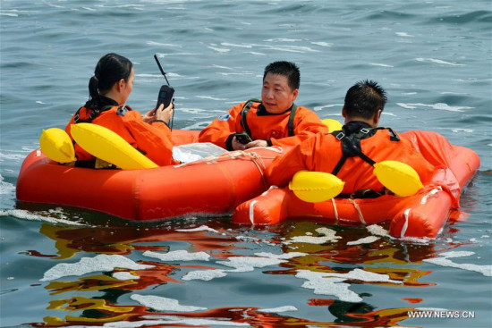 Chinese astronaut Yang Liwei (C) takes a sea survival training in waters off the coast of Yantai in east China's Shandong Province, Aug. 21, 2017. (Xinhua/Guo Xulei) Chinese astronaut Yang Liwei (C) takes a sea survival training in waters off the coast of Yantai in east China's Shandong Province, Aug. 21, 2017. (Xinhua/Guo Xulei)