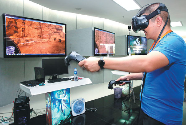 A customer experiences visual reality equipment made by G-bits, a company in Xiamen that focuses on internet game design and development. Jin Liwang / Xinhua A customer experiences visual reality equipment made by G-bits, a company in Xiamen that focuses on internet game design and development. Jin Liwang / Xinhua