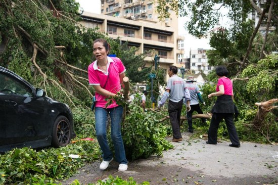 Volunteers of Women's General Association of Macao clean a road in Macao, south China, Aug. 24, 2017. Bringing heavy gusts and rainstorms, Hato destroyed more than 4,000 trees in Macao on Wednesday. (Xinhua) Volunteers of Women's General Association of Macao clean a road in Macao, south China, Aug. 24, 2017. Bringing heavy gusts and rainstorms, Hato destroyed more than 4,000 trees in Macao on Wednesday. (Xinhua)