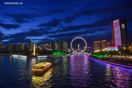 Photo taken on Aug. 25, 2017 shows the night scene of the Tianjin Eye in north China's Tianjin Municipality. The 13th Chinese National Games will open on Aug. 27 in Tianjin. (Xinhua/Li Bo) Photo taken on Aug. 25, 2017 shows the night scene of the Tianjin Eye in north China's Tianjin Municipality. The 13th Chinese National Games will open on Aug. 27 in Tianjin. (Xinhua/Li Bo)