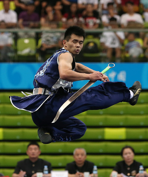 A wushu athlete competes at the Chinese National Games in Tianjin. (WANG ZHUANGFEI/CHINA DAILY) A wushu athlete competes at the Chinese National Games in Tianjin. (WANG ZHUANGFEI/CHINA DAILY)
