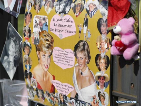 Tributes of photographs and flowers are placed at the Gate of Kensington Palace on the 20th anniversary of the death of Princess Diana in London, Britain on Aug. 31, 2017. (Xinhua/Han Yan) Tributes of photographs and flowers are placed at the Gate of Kensington Palace on the 20th anniversary of the death of Princess Diana in London, Britain on Aug. 31, 2017. (Xinhua/Han Yan)