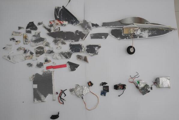 The model plane is shattered into pieces after being hit by the high-speed train. The model plane is shattered into pieces after being hit by the high-speed train.