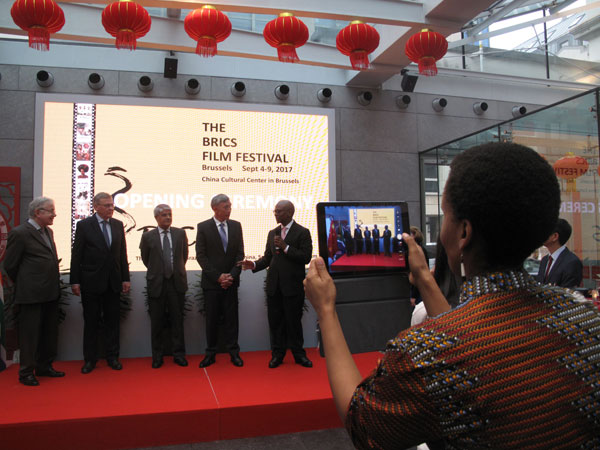 The BRICS countries' ambassadors and representative (from left) Jose Vallim Guerreiro, Alexander Tokovinin, Rakesh Arora, Qu Xing and Baso Sangqu (from left to right) open a film festival on Monday in Brussels. (Photo by Fu Jing/chinadaily.com.cn)