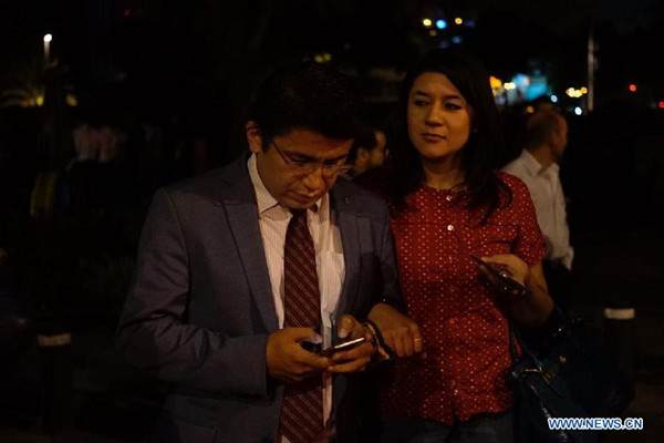 People react on a street after an earthquake jolted Mexico City, capital of Mexico, on Sept. 8, 2017. An earthquake measuring 8.2 on the Richter scale hit off the coast of Chiapas State of Mexico at 12:49 p.m. Beijing time on Friday, according to preliminary reports from the China Earthquake Networks Center. (Xinhua/David de la Paz) People react on a street after an earthquake jolted Mexico City, capital of Mexico, on Sept. 8, 2017. An earthquake measuring 8.2 on the Richter scale hit off the coast of Chiapas State of Mexico at 12:49 p.m. Beijing time on Friday, according to preliminary reports from the China Earthquake Networks Center. (Xinhua/David de la Paz)