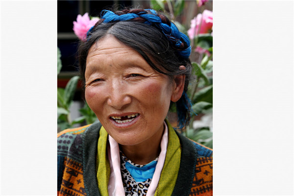 Tsamjo Drolma's family of four was registered as impoverished last year by the Lhunze county government in the Tibet autonomous region. The 49-year-old mother explained to China Daily some of the subsidies her family receives as a result. (Photo/China Daily) Tsamjo Drolma's family of four was registered as impoverished last year by the Lhunze county government in the Tibet autonomous region. The 49-year-old mother explained to China Daily some of the subsidies her family receives as a result. (Photo/China Daily)