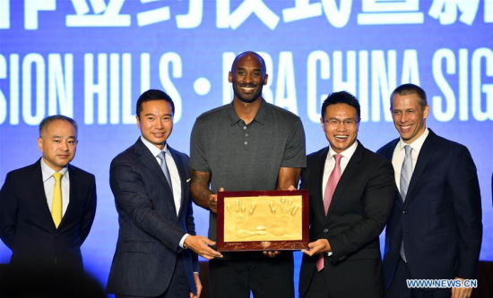 Former NBA basketball player Kobe Bryant (C) poses during a signing ceremony in Haikou, capital of south China's Hainan Province, Sept. 12, 2017. (Xinhua/Guo Cheng) Former NBA basketball player Kobe Bryant (C) poses during a signing ceremony in Haikou, capital of south China's Hainan Province, Sept. 12, 2017. (Xinhua/Guo Cheng)