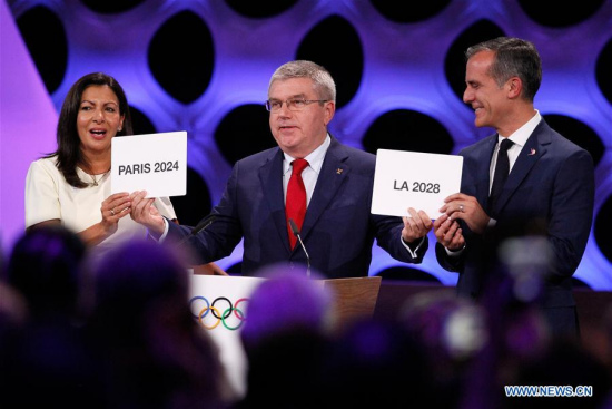International Olympic Committee President Thomas Bach (C) poses for photos with Anne Hidalgo (L), Mayor of Paris, and Eric Garcetti, Mayor of Los Angeles, at the 131st IOC session in Lima, Peru, on Sept. 13, 2017. (Xinhua/Luis Camacho) International Olympic Committee President Thomas Bach (C) poses for photos with Anne Hidalgo (L), Mayor of Paris, and Eric Garcetti, Mayor of Los Angeles, at the 131st IOC session in Lima, Peru, on Sept. 13, 2017. (Xinhua/Luis Camacho)