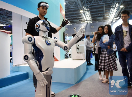 People look at a bionic robot at an exhibition during the 2017 national mass innovation and entrepreneurship week in Beijing, capital of China, Sept. 15, 2017. (Xinhua/Zhang Chenlin) People look at a bionic robot at an exhibition during the 2017 national mass innovation and entrepreneurship week in Beijing, capital of China, Sept. 15, 2017. (Xinhua/Zhang Chenlin)