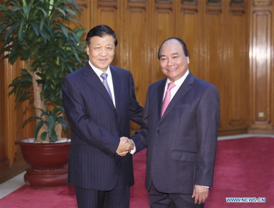 Liu Yunshan (L), a member of the Standing Committee of the Political Bureau of the Communist Party of China Central Committee, meets with Vietnamese Prime Minister Nguyen Xuan Phuc in Hanoi, Vietnam, Sept. 19, 2017. (Xinhua/Ding Lin) Liu Yunshan (L), a member of the Standing Committee of the Political Bureau of the Communist Party of China Central Committee, meets with Vietnamese Prime Minister Nguyen Xuan Phuc in Hanoi, Vietnam, Sept. 19, 2017. (Xinhua/Ding Lin)