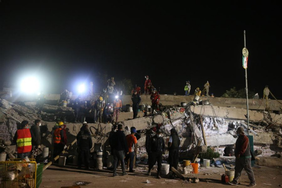 Rescuers work on the debris of a collapsed building in Mexico City, Capital of Mexico, on Sept. 20, 2017. Over 220 people have been killed after a powerful earthquake hit central Mexico on Tuesday, with the death toll expected to rise due to the scale of the temblor, the country's civil protection agency said. (Xinhua/Dan Hang) Rescuers work on the debris of a collapsed building in Mexico City, Capital of Mexico, on Sept. 20, 2017. Over 220 people have been killed after a powerful earthquake hit central Mexico on Tuesday, with the death toll expected to rise due to the scale of the temblor, the country's civil protection agency said. (Xinhua/Dan Hang)