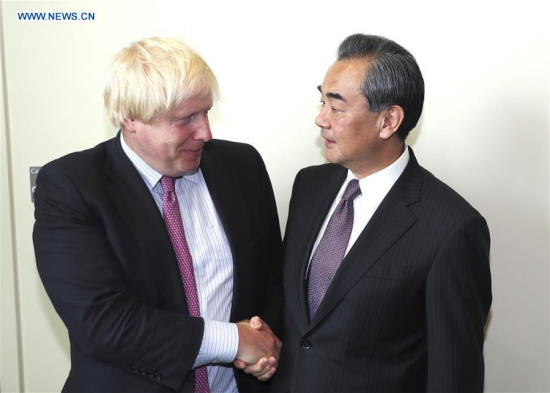 Chinese Foreign Minister Wang Yi (R) shakes hands with his British counterpart Boris Johnson during their meeting at the UN headquarters in New York, on Sept. 19, 2017. (Xinhua/Wang Ying) Chinese Foreign Minister Wang Yi (R) shakes hands with his British counterpart Boris Johnson during their meeting at the UN headquarters in New York, on Sept. 19, 2017. (Xinhua/Wang Ying)