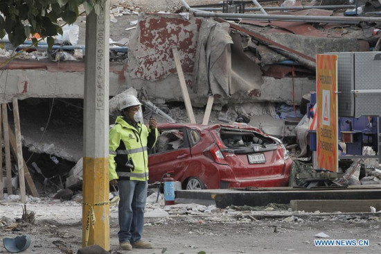 A rescuer works in front of a collapsed building in Mexico City, Capital of Mexico, on Sept. 20, 2017. (Xinhua/Dan Hang) A rescuer works in front of a collapsed building in Mexico City, Capital of Mexico, on Sept. 20, 2017. (Xinhua/Dan Hang)