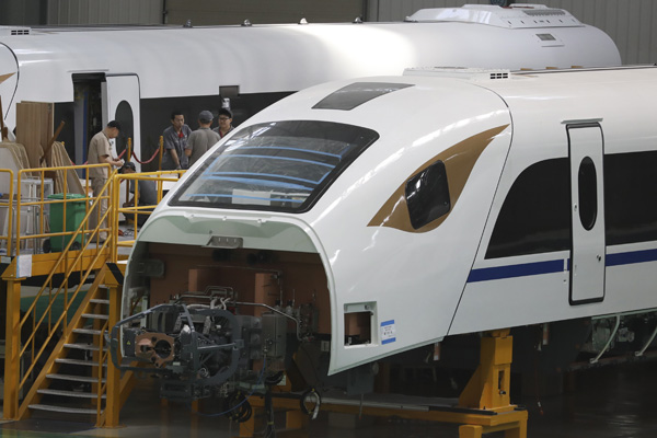 Workers assemble a train in a factory of CRRC Changchun Railway Vehicles Co in Changchun this month. (Photo by ZHU XINGXIN/CHINA DAILY) Workers assemble a train in a factory of CRRC Changchun Railway Vehicles Co in Changchun this month. (Photo by ZHU XINGXIN/CHINA DAILY)