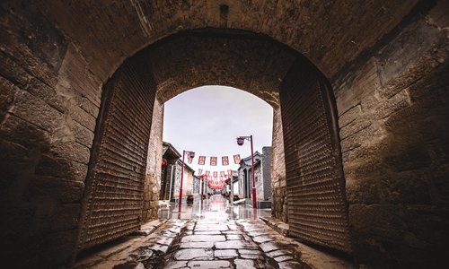A restored ancient village features the local custom of paper cutting. (Photo/Courtesy of the first Zhangjiakou Tourism Development Industry Conference)