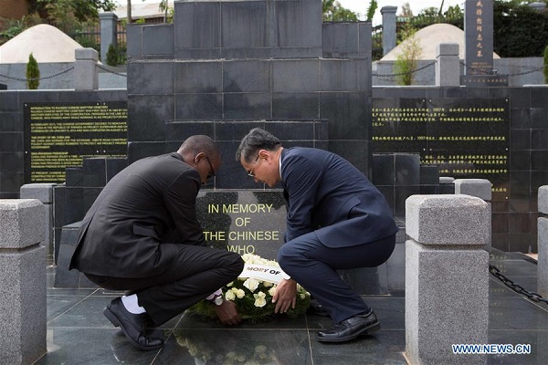Chinese Ambassador to Rwanda Rao Hongwei (R) and Theophile Rurangwa, Director of Asia and Australasia Unit at the Rwandan Foreign Ministry, lay a wreath at the monument of the ten Chinese aid workers who died when working in aid projects for Rwanda at the Chinese martyrs' cemetery in Rulindo district, Rwanda, on Sept. 30, 2017. The Chinese embassy in Rwanda, Chinese community and representatives of the Rwanda government on Saturday paid tribute to ten fallen Chinese aid workers here. (Xinhua/Gabriel Dusabe) Chinese Ambassador to Rwanda Rao Hongwei (R) and Theophile Rurangwa, Director of Asia and Australasia Unit at the Rwandan Foreign Ministry, lay a wreath at the monument of the ten Chinese aid workers who died when working in aid projects for Rwanda at the Chinese martyrs' cemetery in Rulindo district, Rwanda, on Sept. 30, 2017. The Chinese embassy in Rwanda, Chinese community and representatives of the Rwanda government on Saturday paid tribute to ten fallen Chinese aid workers here. (Xinhua/Gabriel Dusabe)