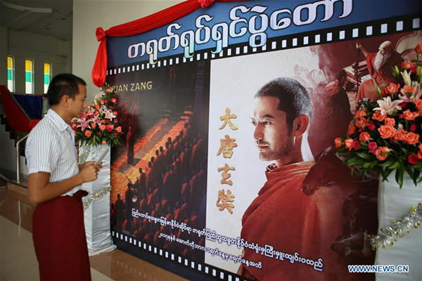 A man takes a look at the poster of Chinese movie Xuan Zang in Nay Pyi Taw of Myanmar on Oct. 1, 2017. Chinese Film Festival 2017 kicked off at the Aungthabyay Cinema in Myanmar's capital of Nay Pyi Taw on Sunday, with two Chinese movies -- Xuan Zang and Kung Fu Yoga depicting the religion and culture of China. (Xinhua/U Aung) A man takes a look at the poster of Chinese movie Xuan Zang in Nay Pyi Taw of Myanmar on Oct. 1, 2017. Chinese Film Festival 2017 kicked off at the Aungthabyay Cinema in Myanmar's capital of Nay Pyi Taw on Sunday, with two Chinese movies -- Xuan Zang and Kung Fu Yoga depicting the religion and culture of China. (Xinhua/U Aung)