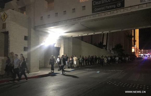 People evacuate after the shooting in Las Vegas, the United States, Oct. 2, 2017. At least 50 people were killed and over 200 others wounded in a mass shooting at a concert Sunday night outside of the Mandalay Bay Hotel in Las Vegas in the U.S. state of Nevada. (Xinhua/Huang Chao) People evacuate after the shooting in Las Vegas, the United States, Oct. 2, 2017. At least 50 people were killed and over 200 others wounded in a mass shooting at a concert Sunday night outside of the Mandalay Bay Hotel in Las Vegas in the U.S. state of Nevada. (Xinhua/Huang Chao)