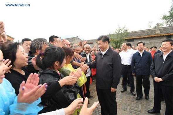 President Xi Jinping meets with local villagers at Songjiagou New Village, a centralized resettlement site under the approach of alleviating poverty through relocation, in Kelan county of Xinzhou city, North China's Shanxi province, June 21, 2017. Xi had a three-day inspection tour in Shanxi from Wednesday. (Photo/Xinhua) President Xi Jinping meets with local villagers at Songjiagou New Village, a centralized resettlement site under the approach of alleviating poverty through relocation, in Kelan county of Xinzhou city, North China's Shanxi province, June 21, 2017. Xi had a three-day inspection tour in Shanxi from Wednesday. (Photo/Xinhua)