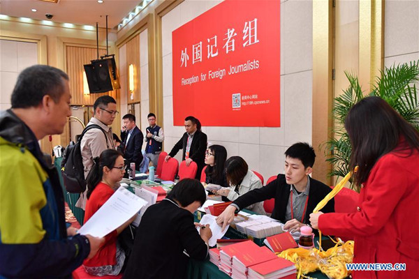Staff members work at the reception for foreign journalists in the Press Center of the 19th National Congress of the Communist Party of China in Beijing, capital of China, Oct. 11, 2017. The press center based in the Beijing Media Center Hotel began operations on Wednesday. (Xinhua/Li Xin) Staff members work at the reception for foreign journalists in the Press Center of the 19th National Congress of the Communist Party of China in Beijing, capital of China, Oct. 11, 2017. The press center based in the Beijing Media Center Hotel began operations on Wednesday. (Xinhua/Li Xin)
