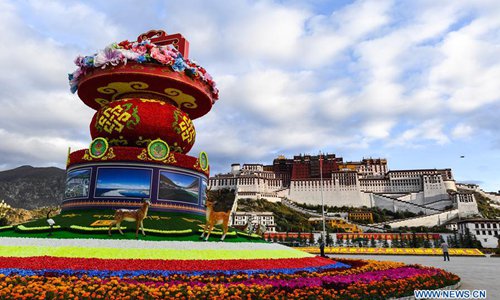 Flower decorations are set to greet the National Day in front of the Potala Palace in Lhasa, capital of southwest China's Tibet Autonomous Region, Sept. 30, 2017. China's National Day falls on Oct. 1. (Xinhua/Purbu Zhaxi) Flower decorations are set to greet the National Day in front of the Potala Palace in Lhasa, capital of southwest China's Tibet Autonomous Region, Sept. 30, 2017. China's National Day falls on Oct. 1. (Xinhua/Purbu Zhaxi)