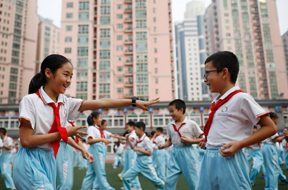 Students at Beijing Haidian Minzu Primary School practice traditional Yue Fei boxing in 2016. (Liu Guanguan/China News Service) Students at Beijing Haidian Minzu Primary School practice traditional Yue Fei boxing in 2016. (Liu Guanguan/China News Service)