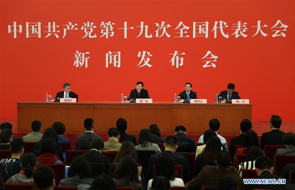 Tuo Zhen (2nd L, rear), spokesperson for the 19th National Congress of the Communist Party of China, holds a press conference at the Great Hall of the People in Beijing, capital of China, Oct. 17, 2017. (Xinhua/Yin Gang) Tuo Zhen (2nd L, rear), spokesperson for the 19th National Congress of the Communist Party of China, holds a press conference at the Great Hall of the People in Beijing, capital of China, Oct. 17, 2017. (Xinhua/Yin Gang)