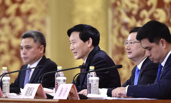 Spokesman for the 19th National Congress of the Communist Party of China Tuo Zhen (center) answers questions from journalists at a news conference at the Great Hall of the People on Tuesday in Beijing. (Photo/Xinhua) Spokesman for the 19th National Congress of the Communist Party of China Tuo Zhen (center) answers questions from journalists at a news conference at the Great Hall of the People on Tuesday in Beijing. (Photo/Xinhua)