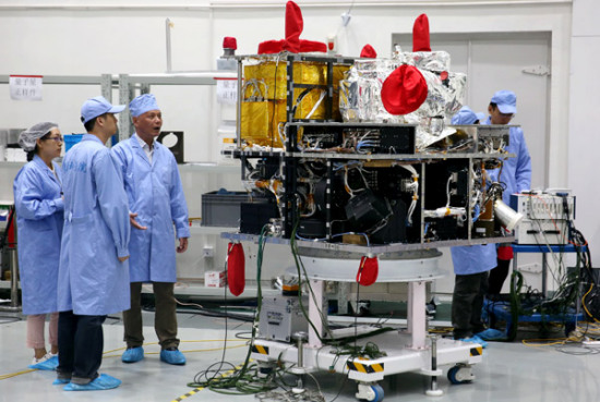 Scientists work on China's first quantum science satellite at a research center of the Chinese Academy of Sciences in Shanghai in May last year. (Photo/Xinhua) Scientists work on China's first quantum science satellite at a research center of the Chinese Academy of Sciences in Shanghai in May last year. (Photo/Xinhua)