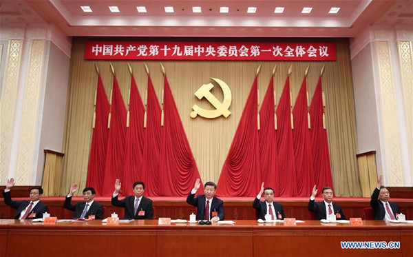 Xi Jinping (C), Li Keqiang (3rd R), Li Zhanshu (3rd L), Wang Yang (2nd R), Wang Huning (2nd L), Zhao Leji (1st R) and Han Zheng (1st L) attend the first plenary session of the 19th Communist Party of China (CPC) Central Committee at the Great Hall of the People in Beijing, capital of China, Oct. 25, 2017. (Xinhua/Ju Peng) Xi Jinping (C), Li Keqiang (3rd R), Li Zhanshu (3rd L), Wang Yang (2nd R), Wang Huning (2nd L), Zhao Leji (1st R) and Han Zheng (1st L) attend the first plenary session of the 19th Communist Party of China (CPC) Central Committee at the Great Hall of the People in Beijing, capital of China, Oct. 25, 2017. (Xinhua/Ju Peng)