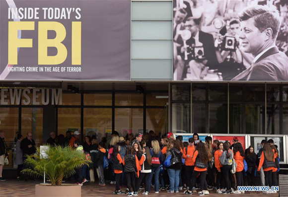 Visitors line under a poster of former U.S. President John F. Kennedy to enter the Newseum in Washington D.C., the United States, on Oct. 26, 2017. The U.S. National Archives is set to release on Thursday the previously classified files related to former President John F. Kennedy's assassination more than half a century ago. (Xinhua/Yin Bogu) Visitors line under a poster of former U.S. President John F. Kennedy to enter the Newseum in Washington D.C., the United States, on Oct. 26, 2017. The U.S. National Archives is set to release on Thursday the previously classified files related to former President John F. Kennedy's assassination more than half a century ago. (Xinhua/Yin Bogu)
